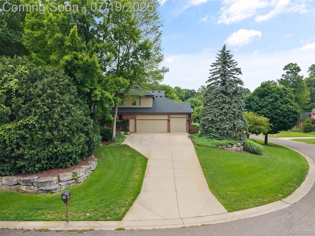 260 Forest Crest Dr, Commerce Twp, MI 48390 - view of front of house with concrete driveway, a front yard, and a garage