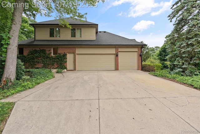 260 Forest Crest Dr, Commerce Twp, MI 48390 - traditional-style house featuring driveway, brick siding, an attached garage, and roof with shingles