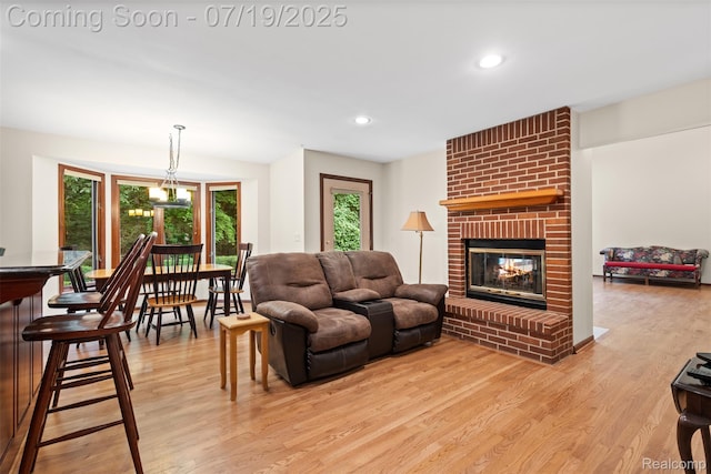 260 Forest Crest Dr, Commerce Twp, MI 48390 - living area with light wood-style flooring, recessed lighting, and a fireplace