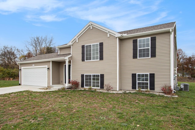 5487 Mammoth Dr SE, Caledonia, MI 49316 - view of front of property with a garage, driveway, and a front yard
