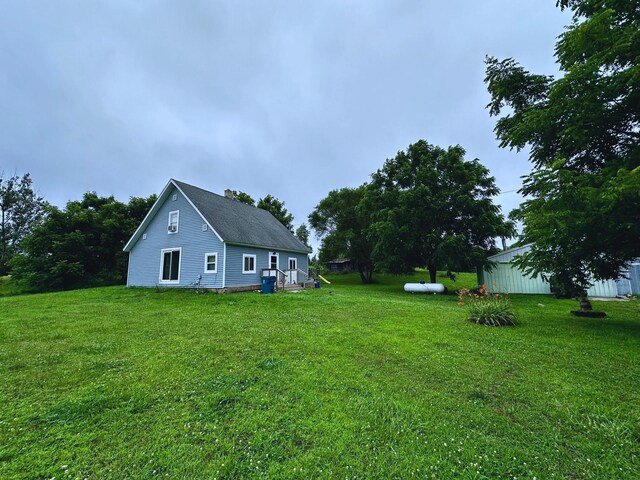 8210 E Pierce Rd, Hesperia, MI 49421 - view of property exterior featuring a yard and a chimney