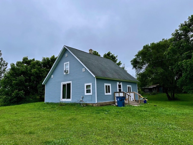 8210 E Pierce Rd, Hesperia, MI 49421 - back of house with a chimney, a yard, and roof with shingles