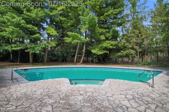 56 Oxford Rd, Grosse Pointe Shores, MI 48236 - view of pool featuring a fenced backyard, a pool with connected hot tub, a patio, and view of scattered trees