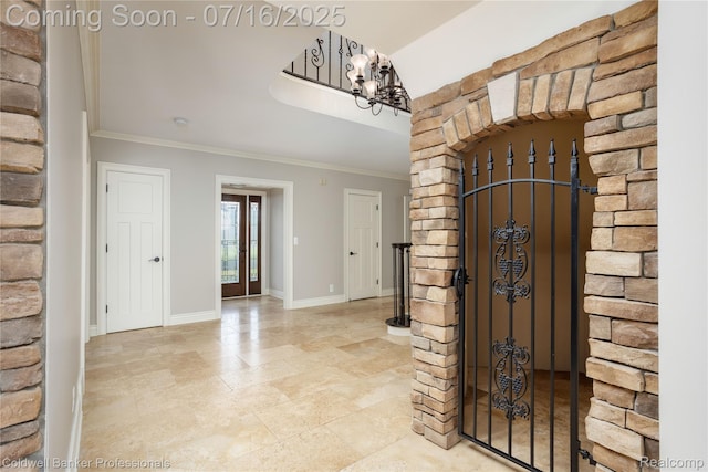 56 Oxford Rd, Grosse Pointe Shores, MI 48236 - entryway featuring ornamental molding and a chandelier