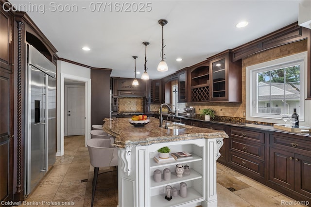 56 Oxford Rd, Grosse Pointe Shores, MI 48236 - kitchen with open shelves, built in fridge, decorative backsplash, a breakfast bar area, and recessed lighting
