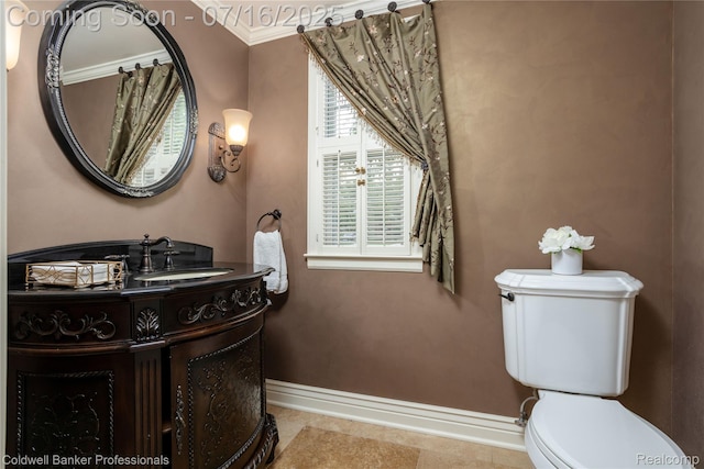 56 Oxford Rd, Grosse Pointe Shores, MI 48236 - bathroom featuring vanity, ornamental molding, and tile patterned flooring