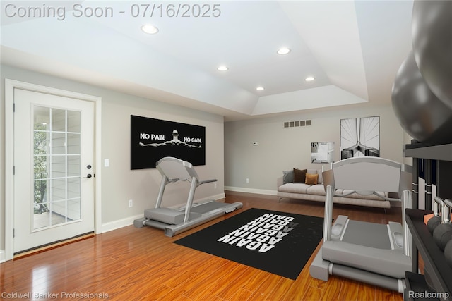 56 Oxford Rd, Grosse Pointe Shores, MI 48236 - exercise room featuring a raised ceiling, wood finished floors, and recessed lighting