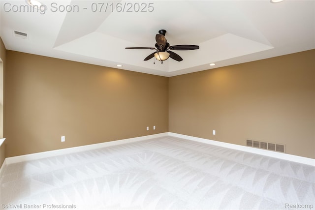 56 Oxford Rd, Grosse Pointe Shores, MI 48236 - empty room featuring a tray ceiling, light colored carpet, a ceiling fan, and recessed lighting