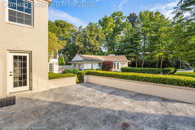 56 Oxford Rd, Grosse Pointe Shores, MI 48236 - view of front facade with brick siding and view of scattered trees