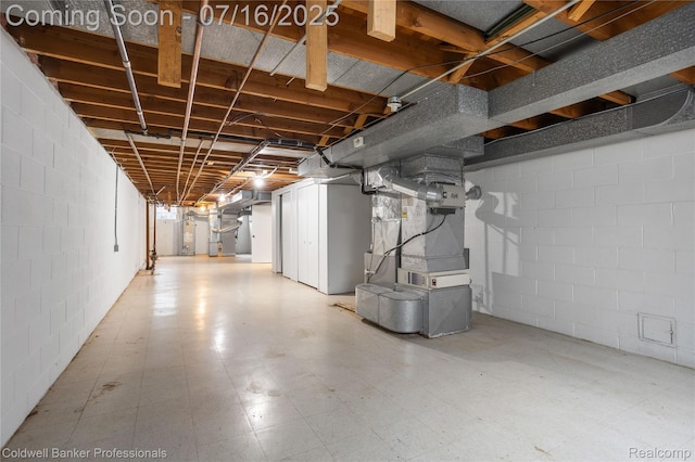 56 Oxford Rd, Grosse Pointe Shores, MI 48236 - unfinished below grade area with heating unit, light floors, and water heater