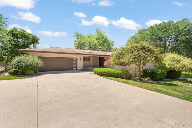 579 Budlong St, Adrian, MI 49221 - ranch-style home featuring an attached garage and concrete driveway