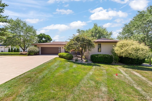 579 Budlong St, Adrian, MI 49221 - single story home featuring driveway, an attached garage, and a front yard
