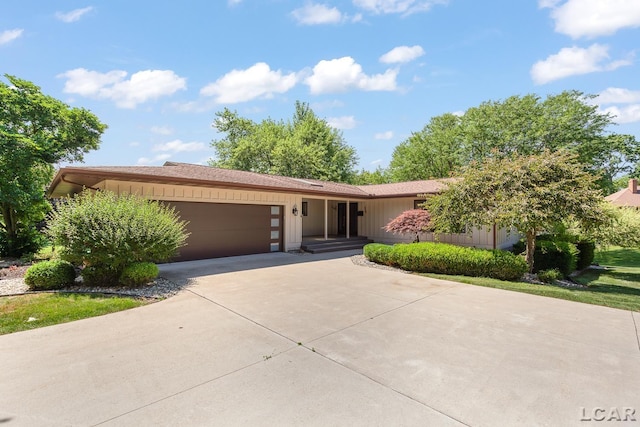 579 Budlong St, Adrian, MI 49221 - view of front of property featuring a garage and driveway