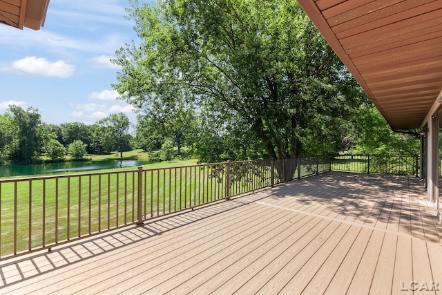 579 Budlong St, Adrian, MI 49221 - deck with a water view, a yard, and view of wooded area