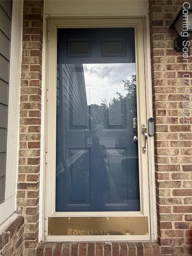 31199 Columbia Dr, Novi, MI 48377 - doorway to property with brick siding