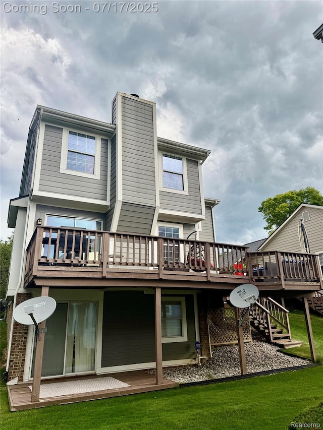 31199 Columbia Dr, Novi, MI 48377 - back of house with a wooden deck, a chimney, and a lawn