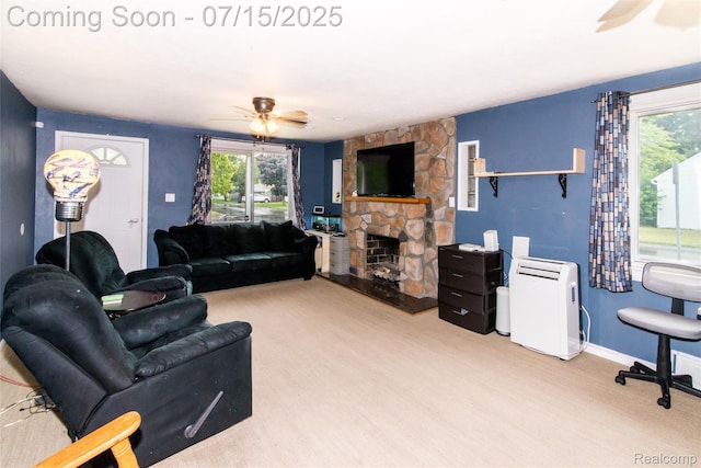 5758 N Parent St, Westland, MI 48185 - living room with ceiling fan, plenty of natural light, and a stone fireplace