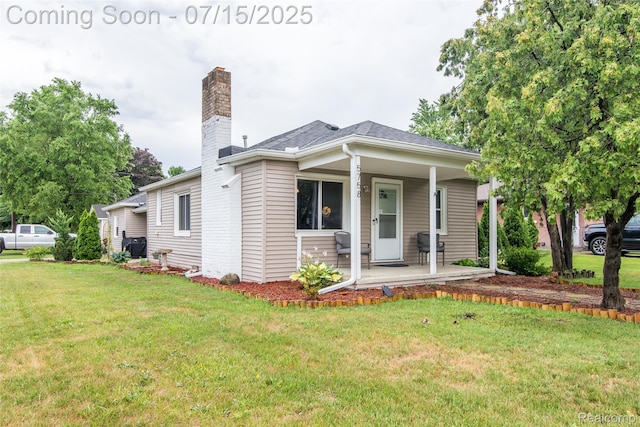 5758 N Parent St, Westland, MI 48185 - bungalow-style house with covered porch, a front lawn, a chimney, and a shingled roof
