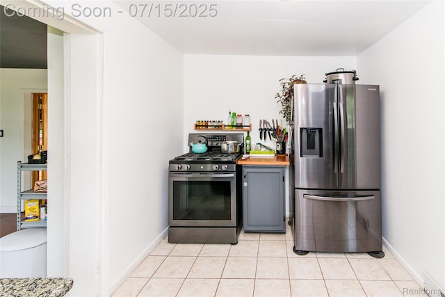 5758 N Parent St, Westland, MI 48185 - kitchen with stainless steel appliances, light tile patterned floors, and gray cabinets