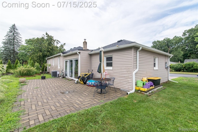 5758 N Parent St, Westland, MI 48185 - back of house featuring a yard, a patio, and a chimney