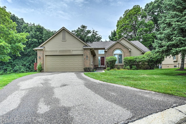 7071 Deerwood Trl Unit 28, West Bloomfield, MI 48323 - ranch-style house featuring brick siding, driveway, a garage, a front yard, and a shingled roof