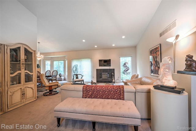 7071 Deerwood Trl Unit 28, West Bloomfield, MI 48323 - living room featuring light carpet, a chandelier, recessed lighting, and a glass covered fireplace