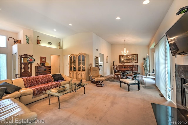 7071 Deerwood Trl Unit 28, West Bloomfield, MI 48323 - carpeted living area featuring lofted ceiling, a chandelier, and recessed lighting