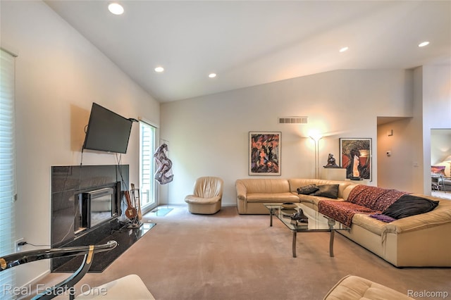 7071 Deerwood Trl Unit 28, West Bloomfield, MI 48323 - carpeted living area with vaulted ceiling, recessed lighting, and a glass covered fireplace