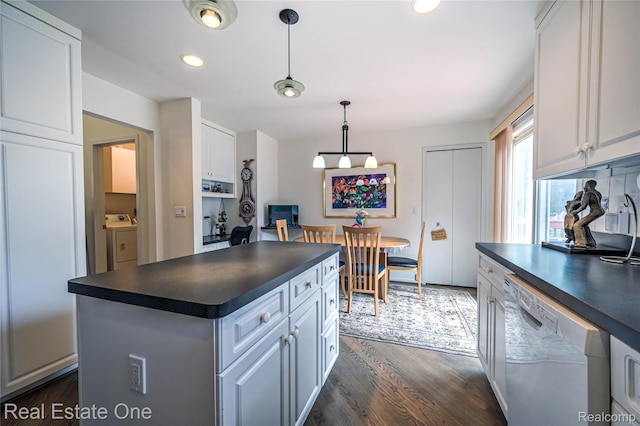 7071 Deerwood Trl Unit 28, West Bloomfield, MI 48323 - kitchen with dishwasher, dark countertops, washing machine and clothes dryer, white cabinetry, and dark wood-style floors
