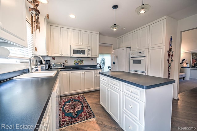 7071 Deerwood Trl Unit 28, West Bloomfield, MI 48323 - kitchen featuring white appliances, dark countertops, dark wood-style flooring, white cabinetry, and recessed lighting