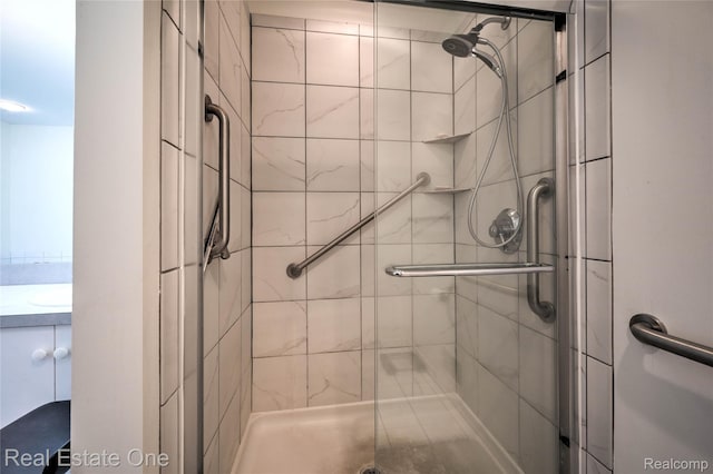 7071 Deerwood Trl Unit 28, West Bloomfield, MI 48323 - bathroom with a shower stall and vanity