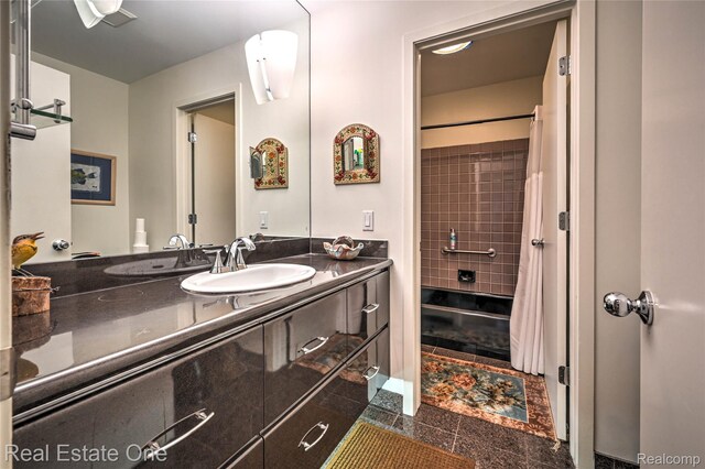 7071 Deerwood Trl Unit 28, West Bloomfield, MI 48323 - bathroom featuring vanity and curtained shower
