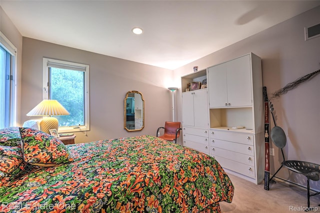 7071 Deerwood Trl Unit 28, West Bloomfield, MI 48323 - bedroom with light colored carpet and recessed lighting