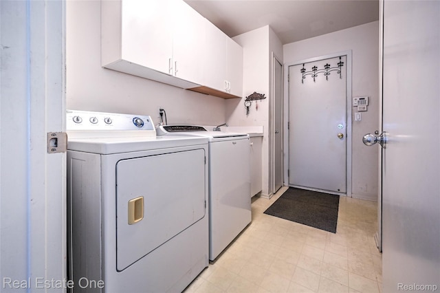 7071 Deerwood Trl Unit 28, West Bloomfield, MI 48323 - laundry room with cabinet space, independent washer and dryer, and light floors