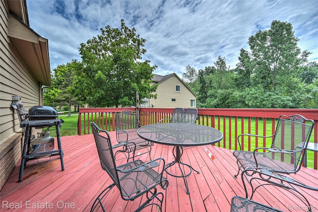 7071 Deerwood Trl Unit 28, West Bloomfield, MI 48323 - wooden terrace featuring outdoor dining area, a lawn, and grilling area