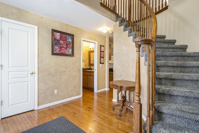 7269 Wellington Ln, Ypsilanti, MI 48197 - stairway featuring hardwood / wood-style flooring and a textured wall