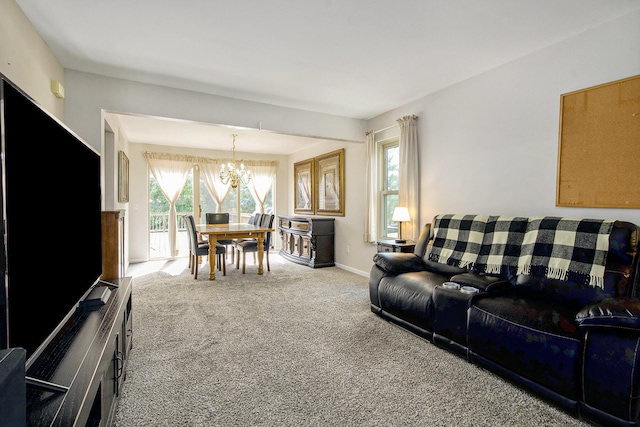 7269 Wellington Ln, Ypsilanti, MI 48197 - carpeted living room featuring a chandelier and baseboards