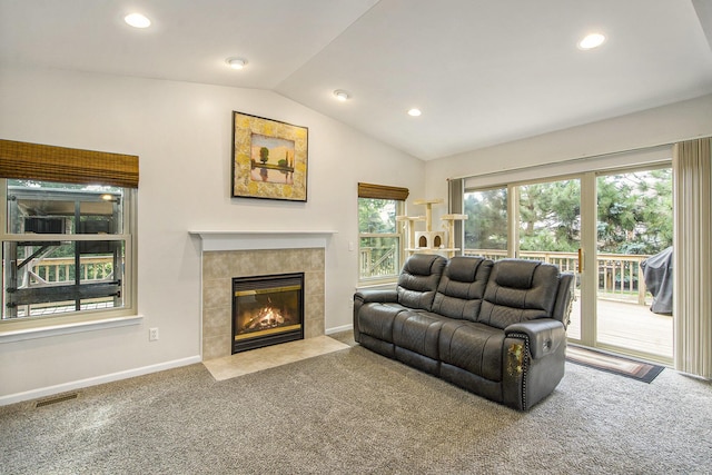 7269 Wellington Ln, Ypsilanti, MI 48197 - carpeted living room with a tile fireplace, recessed lighting, and lofted ceiling