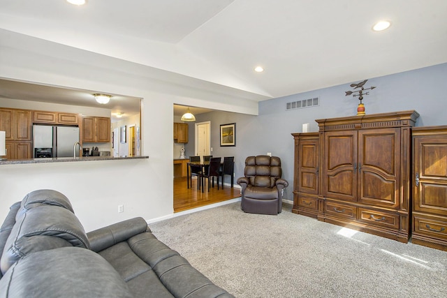 7269 Wellington Ln, Ypsilanti, MI 48197 - living area with carpet, lofted ceiling, and recessed lighting