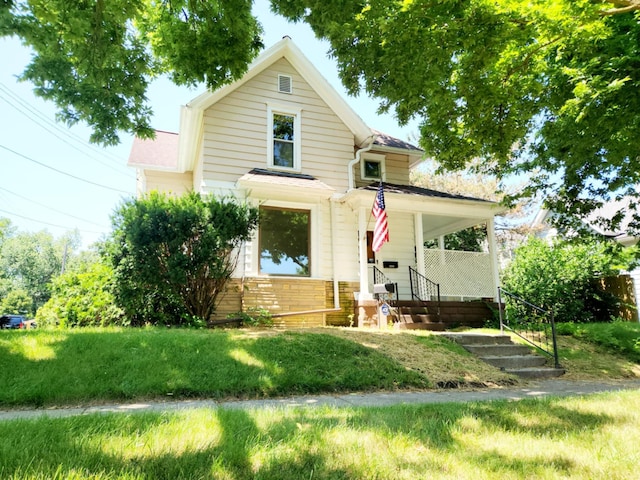 214 S Gorham St, Jackson, MI 49203 - view of front facade featuring covered porch and brick siding