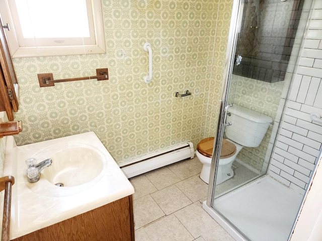 214 S Gorham St, Jackson, MI 49203 - full bath with a baseboard heating unit, a shower stall, vanity, and tile patterned flooring
