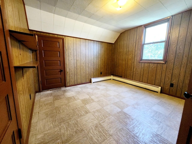214 S Gorham St, Jackson, MI 49203 - bonus room featuring vaulted ceiling, light flooring, wood walls, and baseboard heating