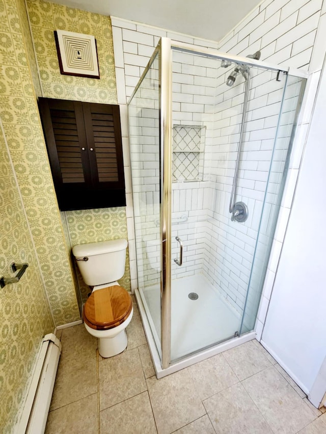 214 S Gorham St, Jackson, MI 49203 - bathroom featuring a baseboard heating unit, a stall shower, and tile patterned floors