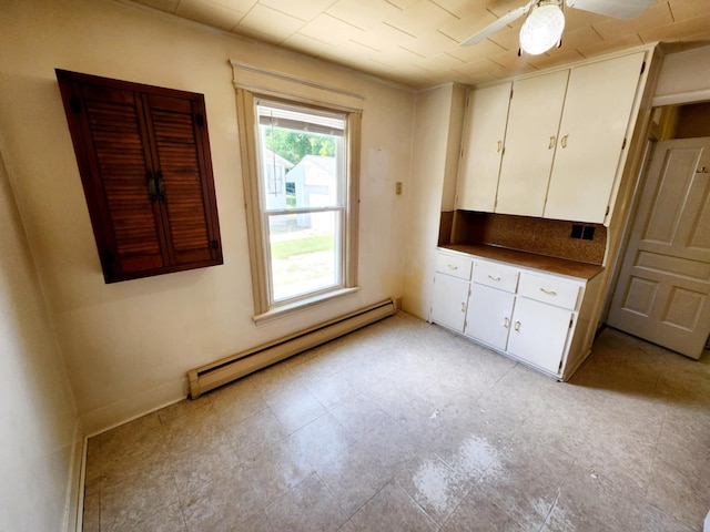 214 S Gorham St, Jackson, MI 49203 - unfurnished bedroom featuring a baseboard radiator
