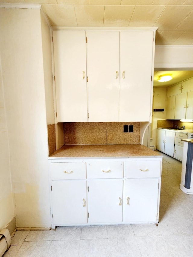 214 S Gorham St, Jackson, MI 49203 - kitchen featuring white cabinets and light countertops