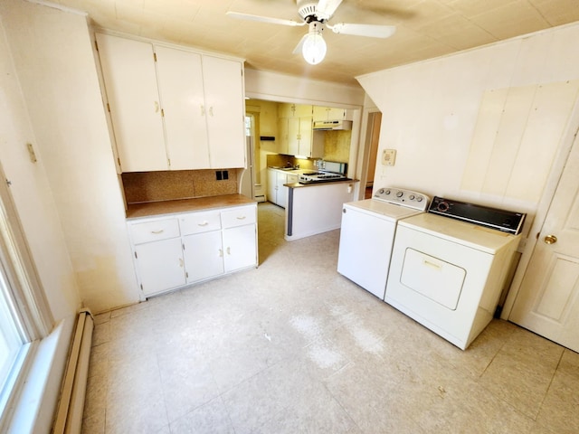 214 S Gorham St, Jackson, MI 49203 - laundry room with washer and clothes dryer, a ceiling fan, and baseboard heating