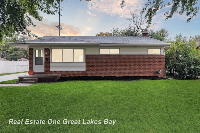 2270 Anderson Rd, Saginaw, MI 48603 - view of front of home featuring brick siding, a chimney, and roof with shingles
