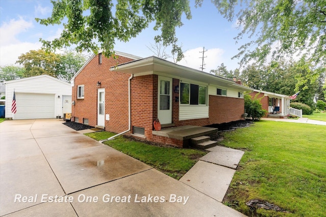 2270 Anderson Rd, Saginaw, MI 48603 - view of front of house featuring brick siding, an outbuilding, a front lawn, a garage, and covered porch