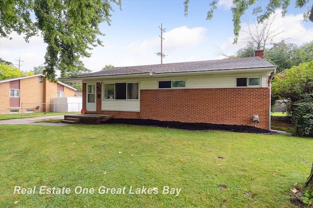 2270 Anderson Rd, Saginaw, MI 48603 - back of property with brick siding and a chimney