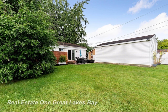 2270 Anderson Rd, Saginaw, MI 48603 - view of yard featuring an outbuilding